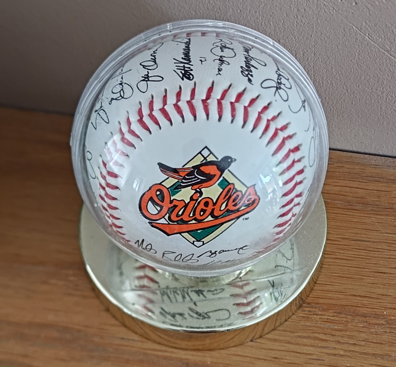 And that I got a baseball signed by one of the teams And that I got a baseball signed by one of the teams - a heavily-signed baseball in a specially-made plastic case with a plinth-like base.